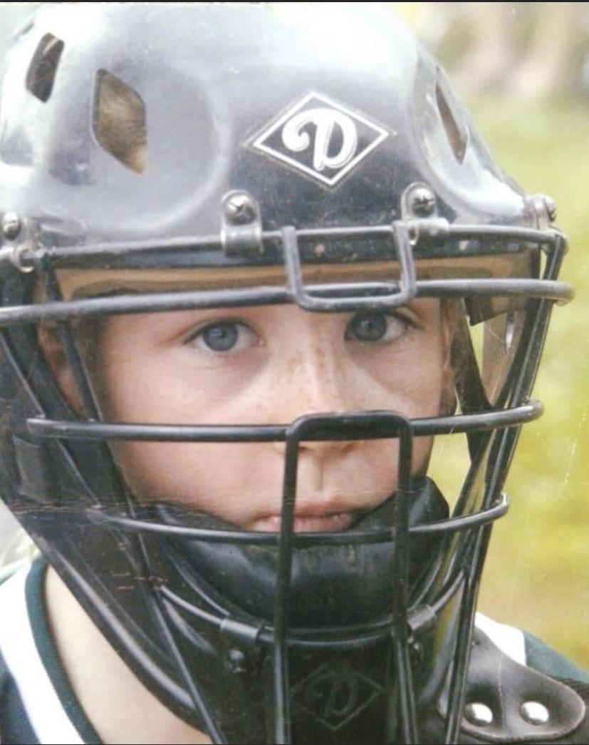 Close-up of catcher wearing protective face mask