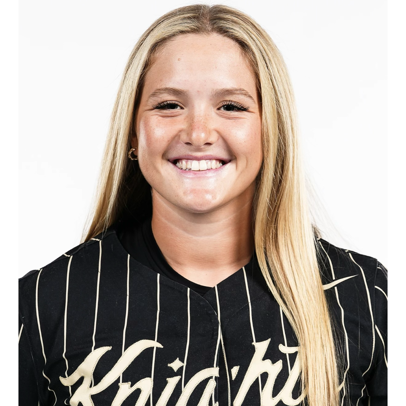 Smiling female athlete in black Knights jersey